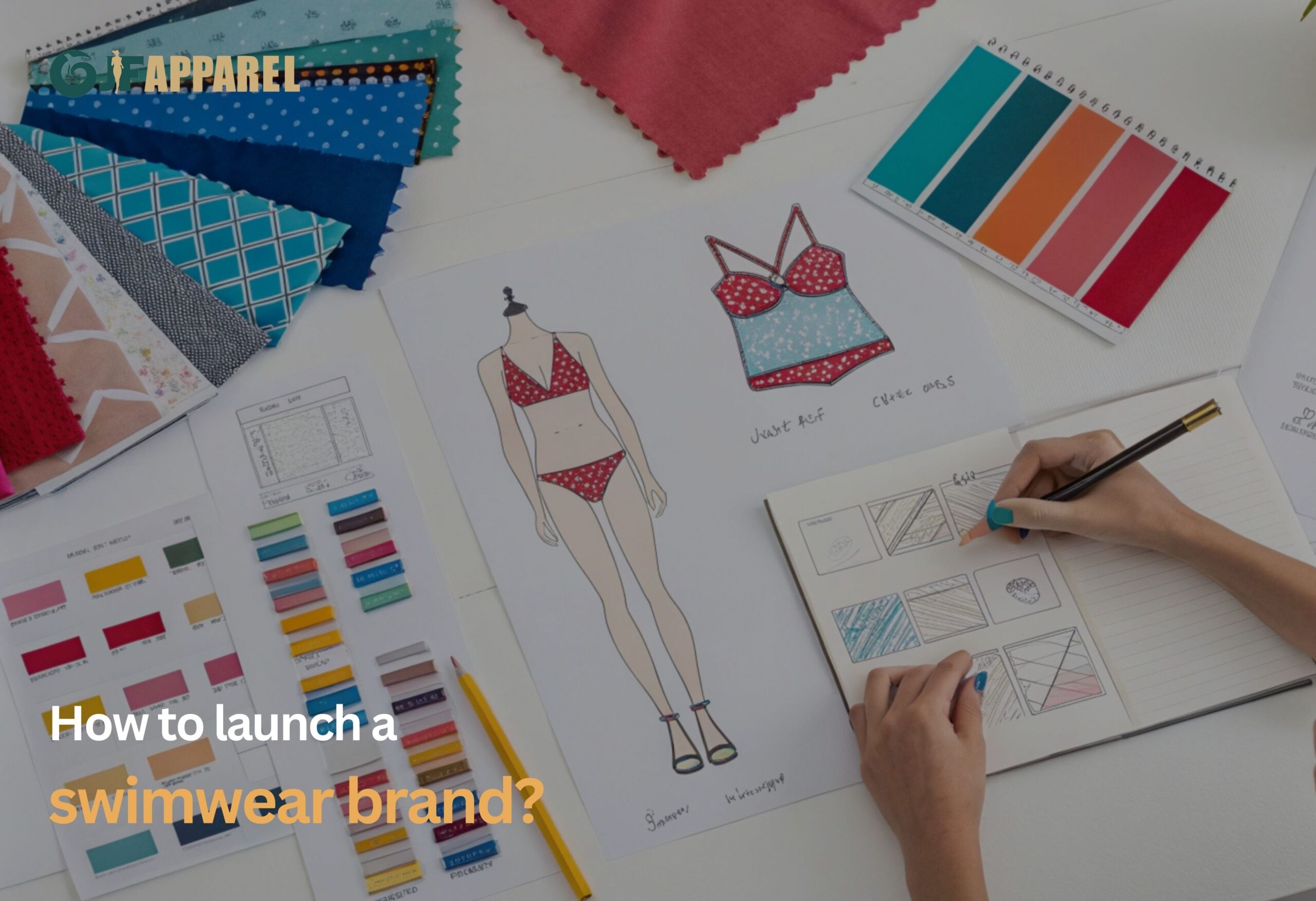 Designer creates swimwear concept, surrounded by fabrics and color swatches.