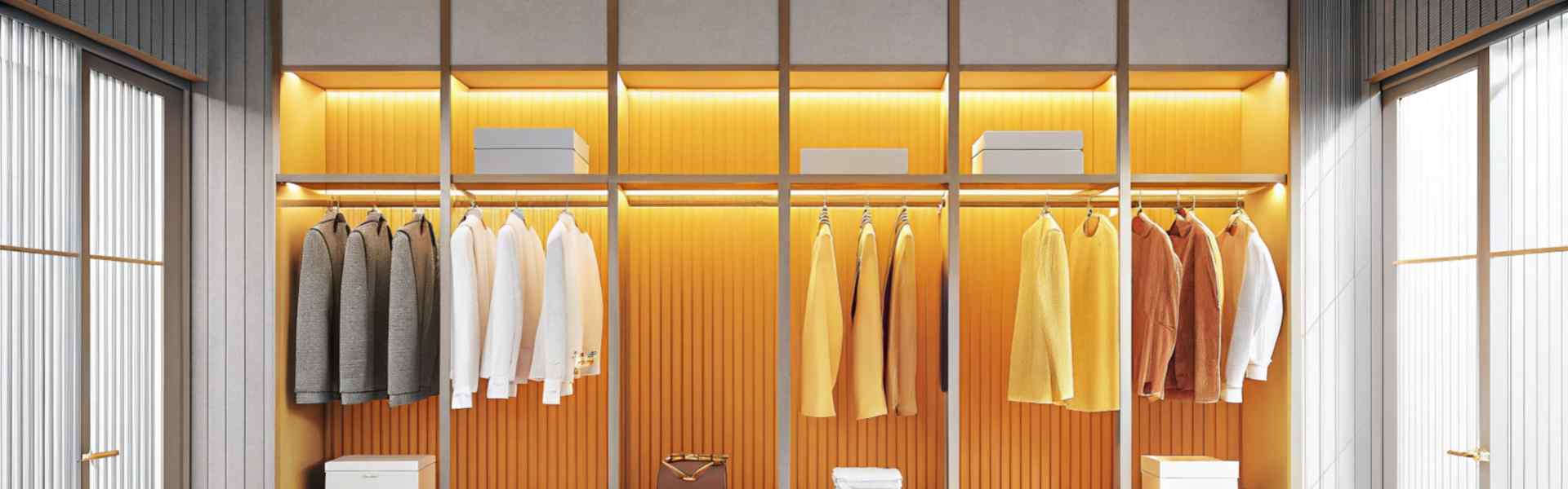 Sleek wardrobe with illuminated sections displaying neatly arranged clothes and accessories.