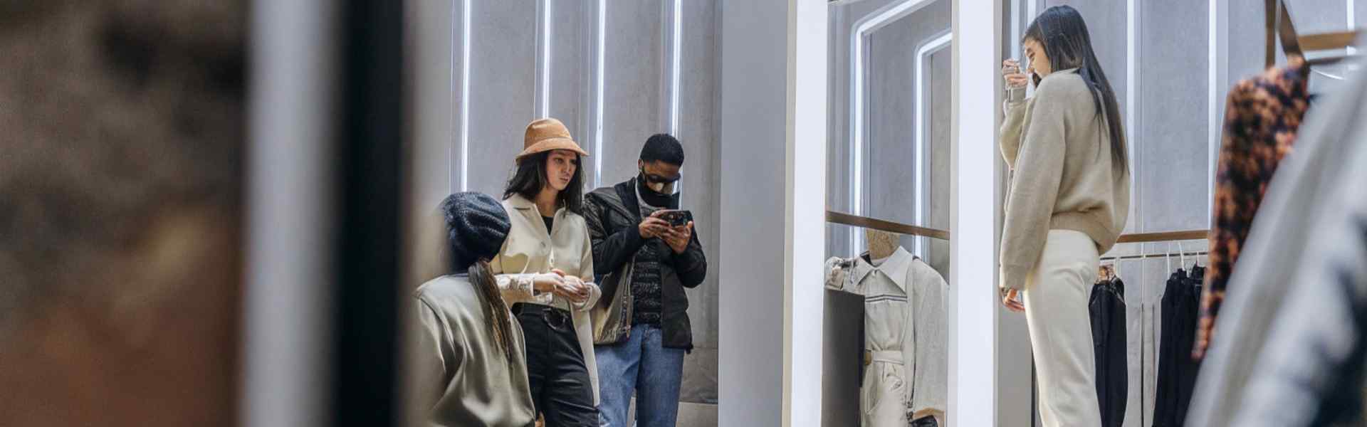 Group shopping in a modern fashion boutique.