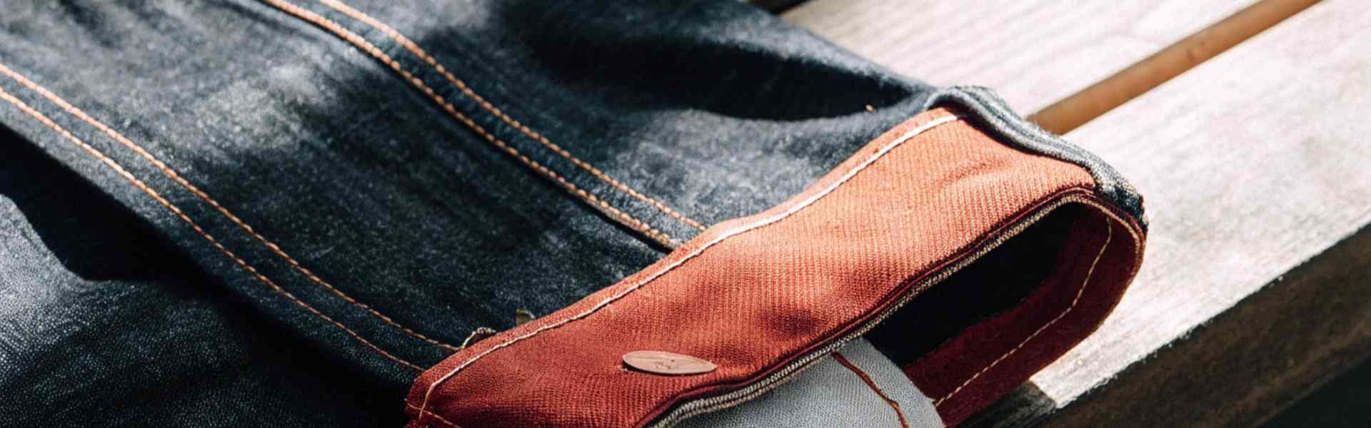 Close-up of selvedge denim jeans with contrast stitching.