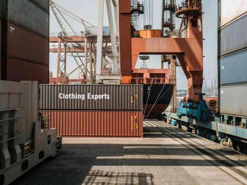 Shipping containers at a port labeled "Clothing Exports."