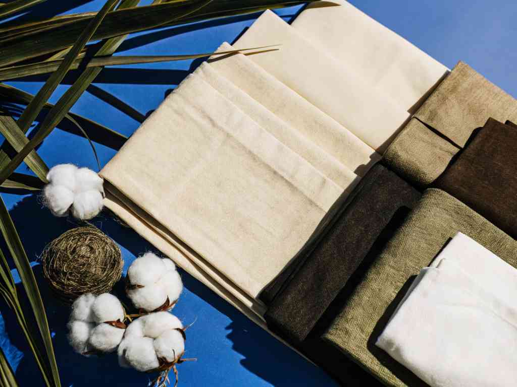 Natural cotton fabrics in earth tones with cotton bolls