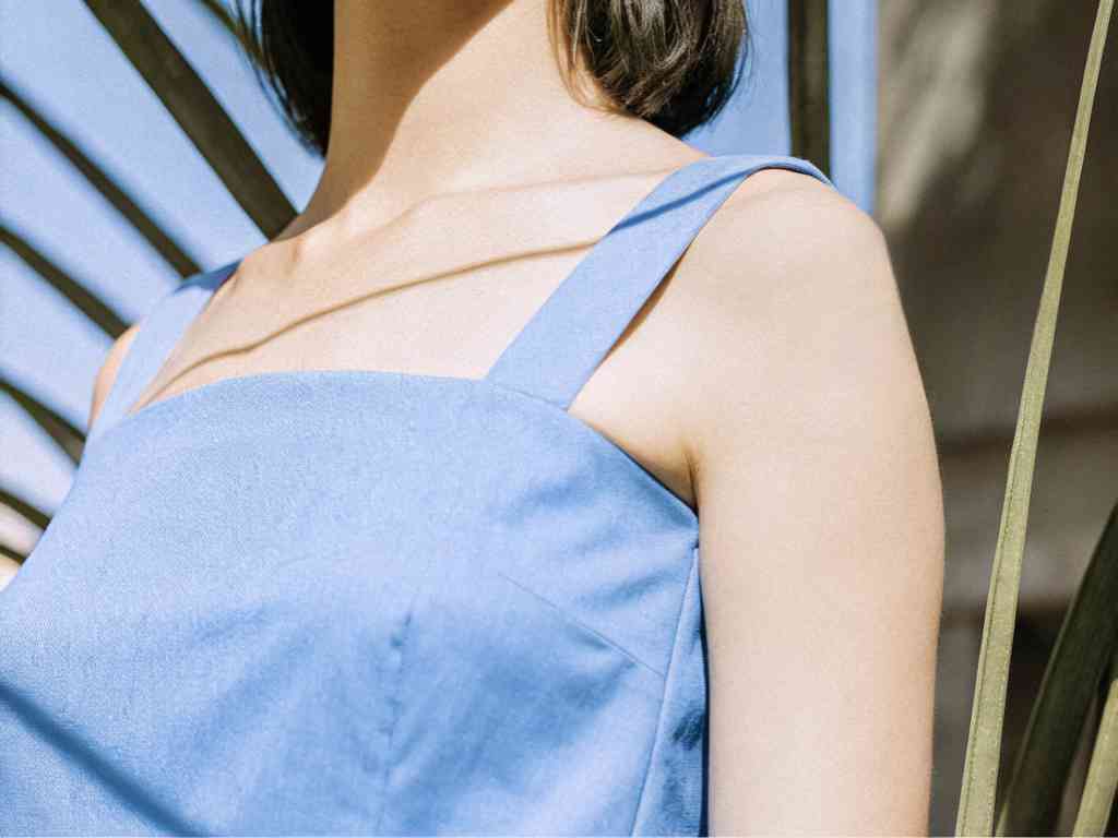 Close-up of light blue sleeveless dress