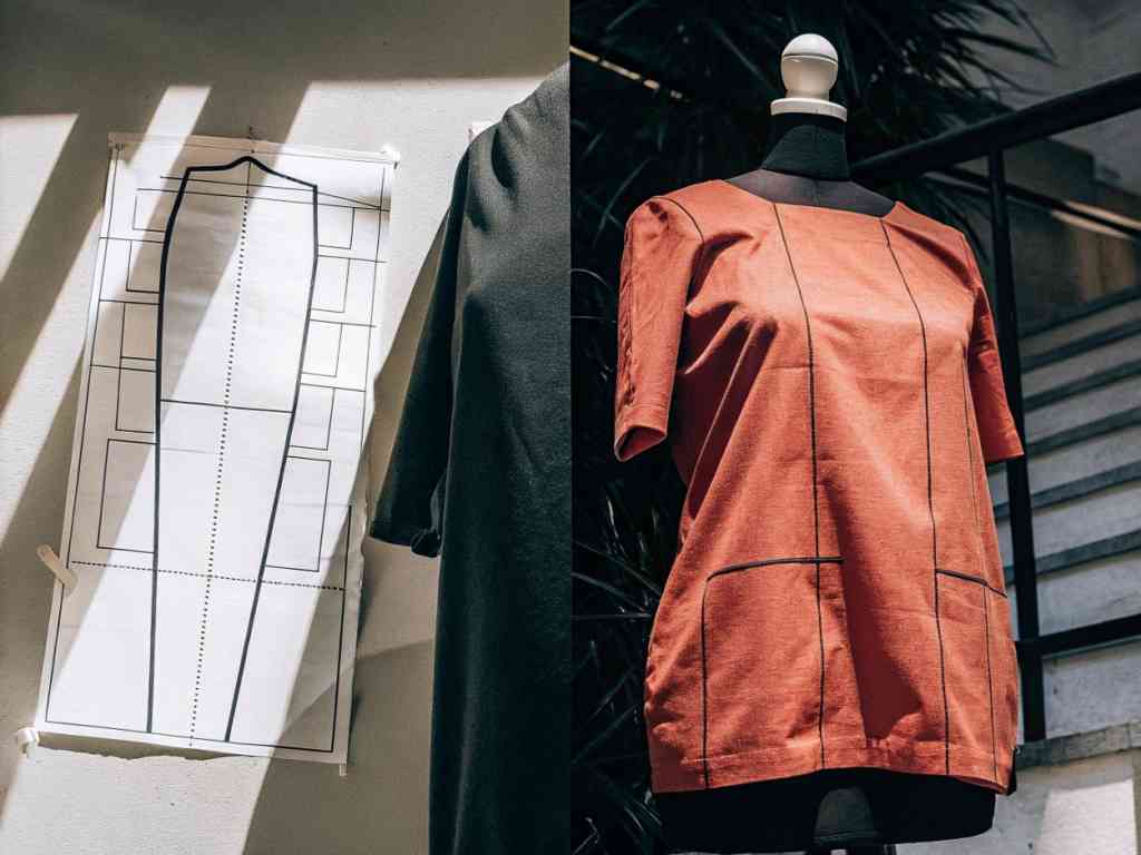 Sewing pattern sketch beside mannequin with red prototype top.