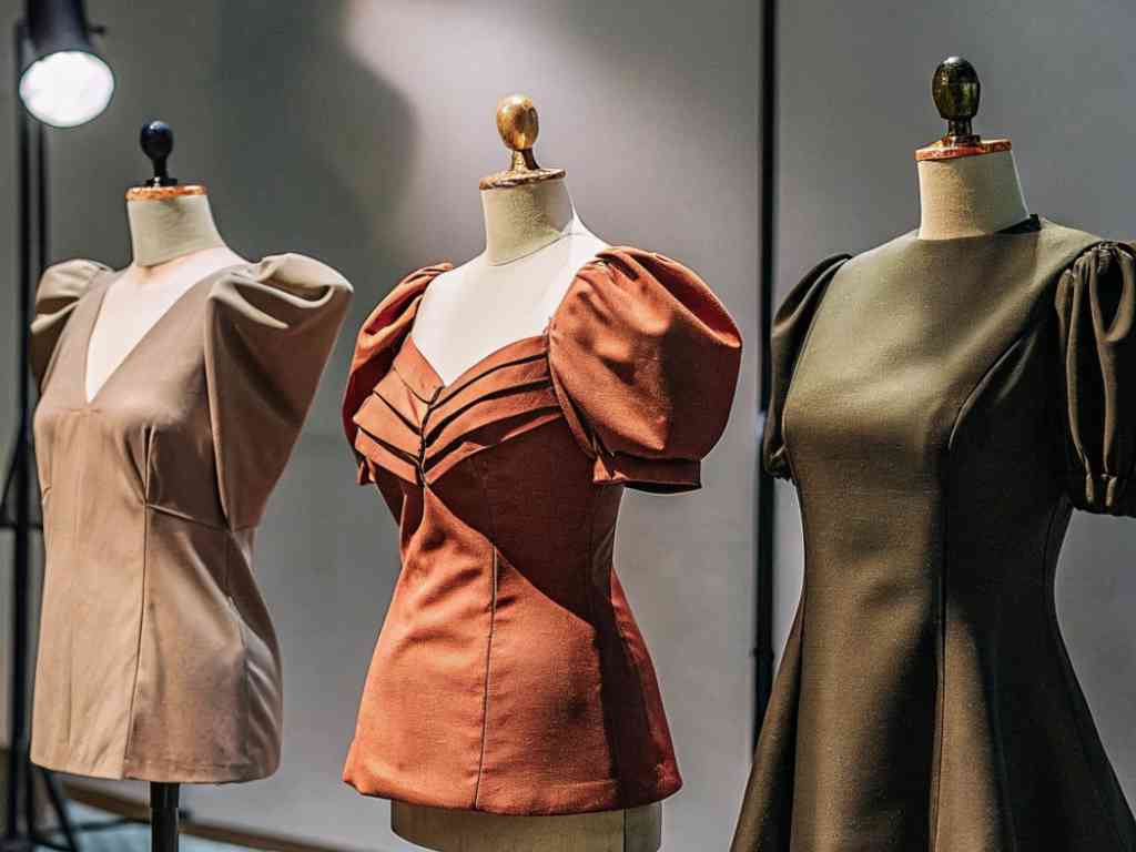 Three mannequins displaying puff sleeve fashion tops