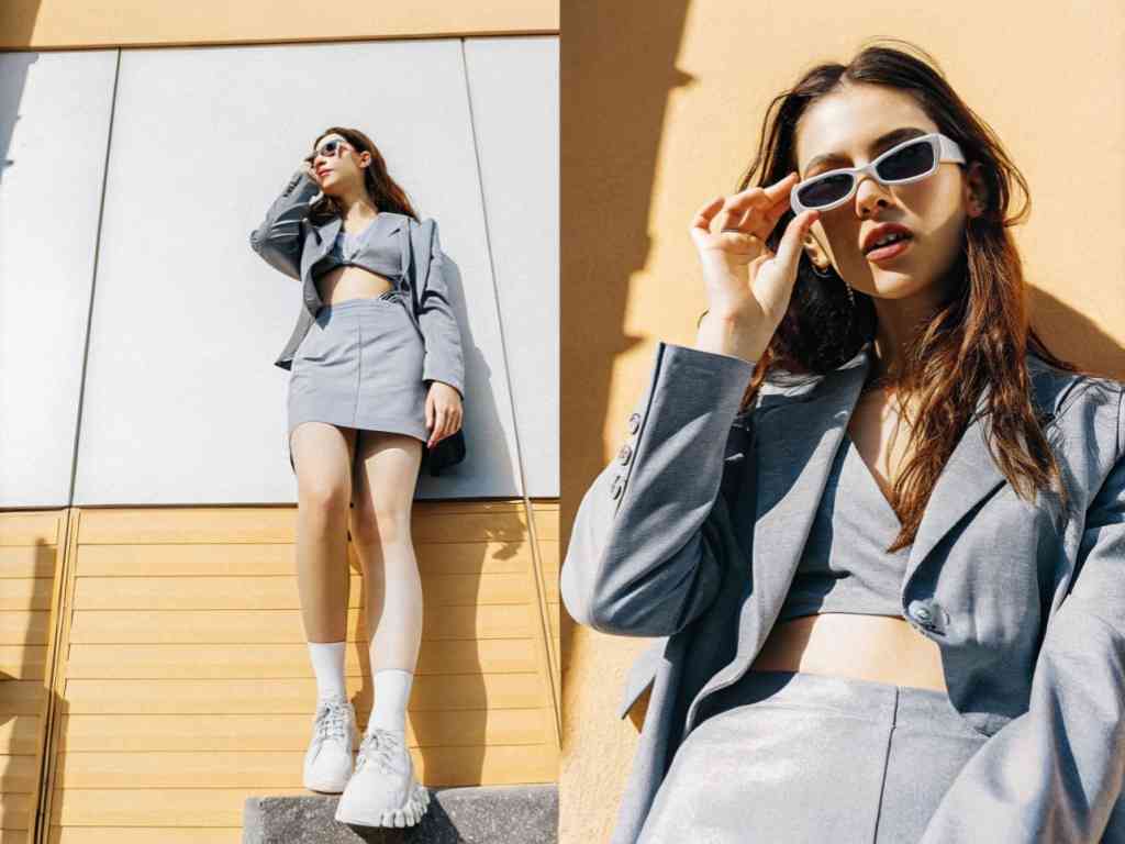 Woman in silver crop blazer and skirt in sunlight