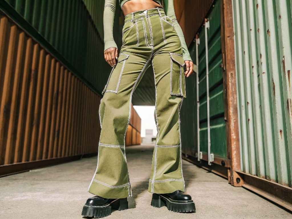 High-waisted khaki flare cargo pants with white contrast stitching